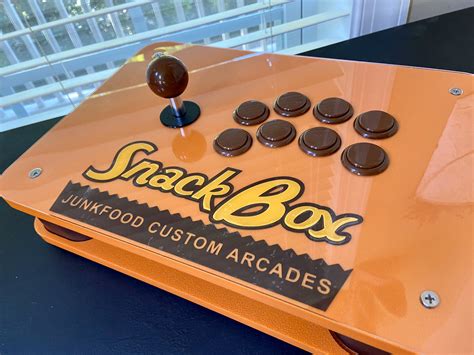 You can also visit Junk Food Custom Arcades on their website here to see what they have to offer! Pros. Family owned and operated. (2 man show!) Good value for price. (base shell starts at $79+, metal pins and strap are …